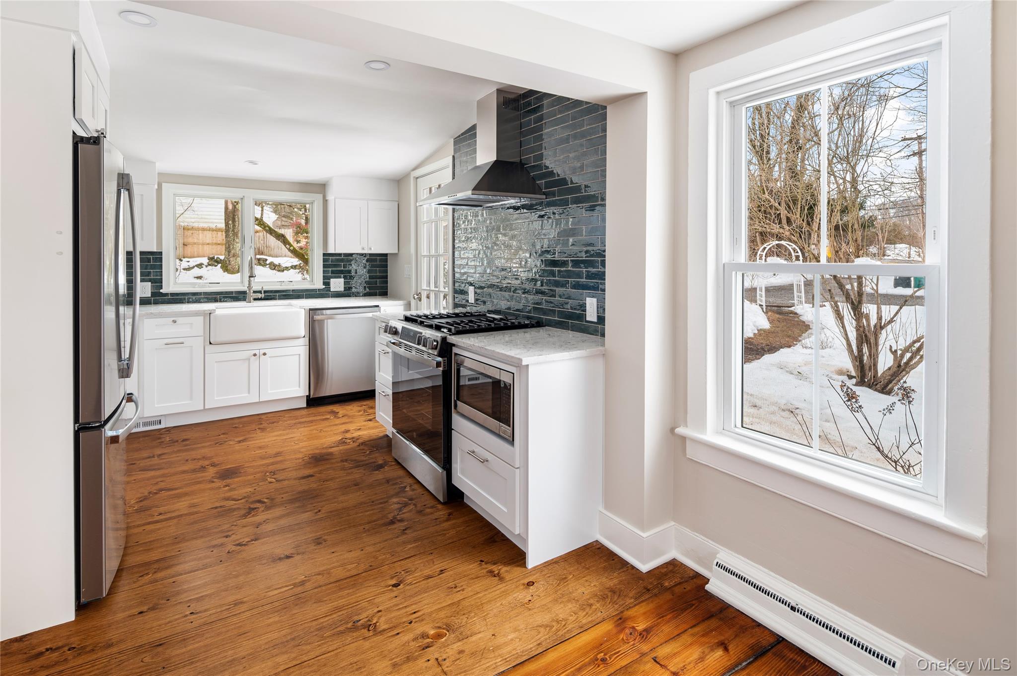 277 Old Post Road Bedford, NY 10506 - Photo 15 of 39 a kitchen with stainless steel appliances granite countertop a stove and a refrigerator