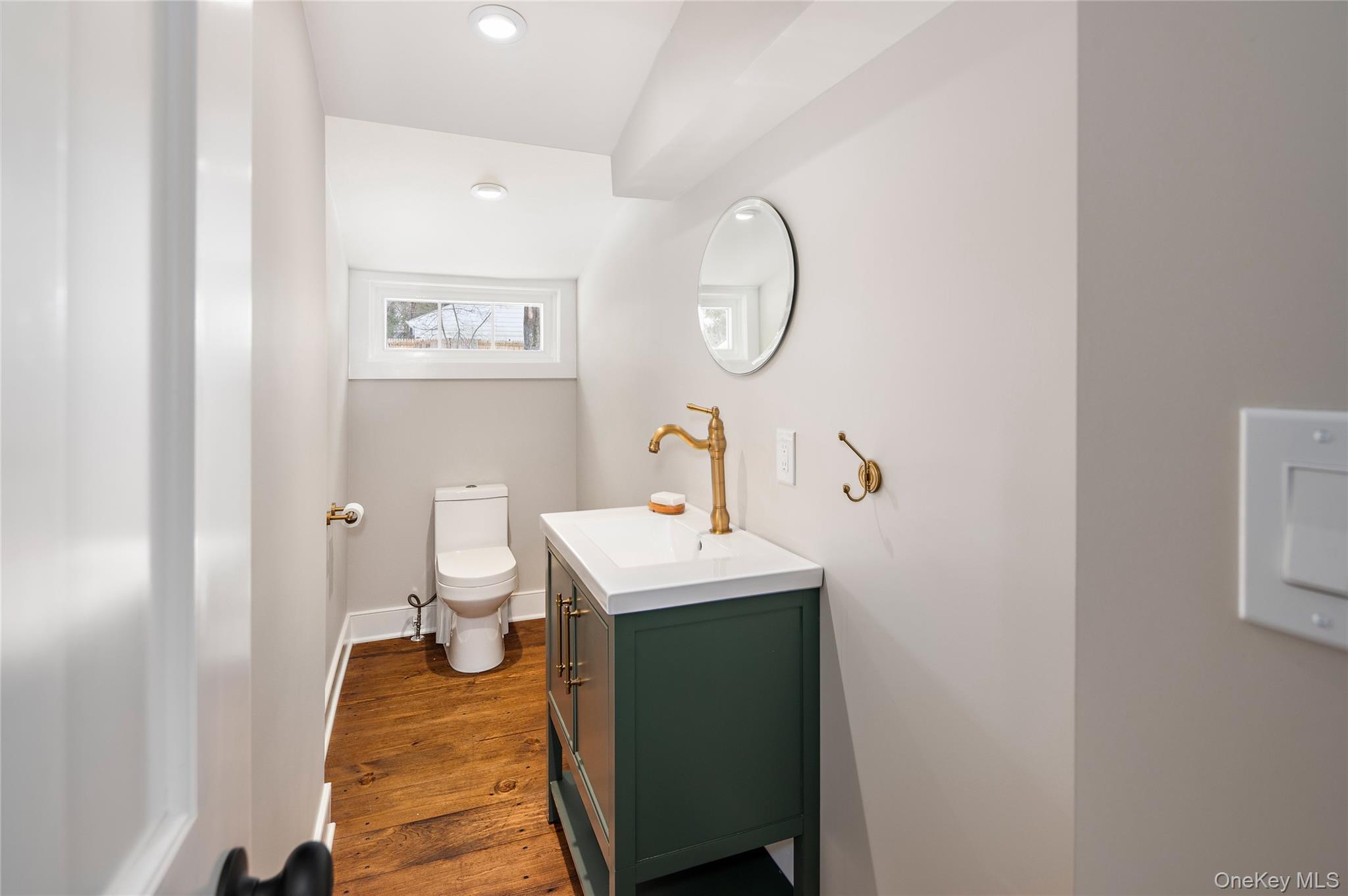 277 Old Post Road Bedford, NY 10506 - Photo 20 of 39 a bathroom with a sink toilet and a mirror