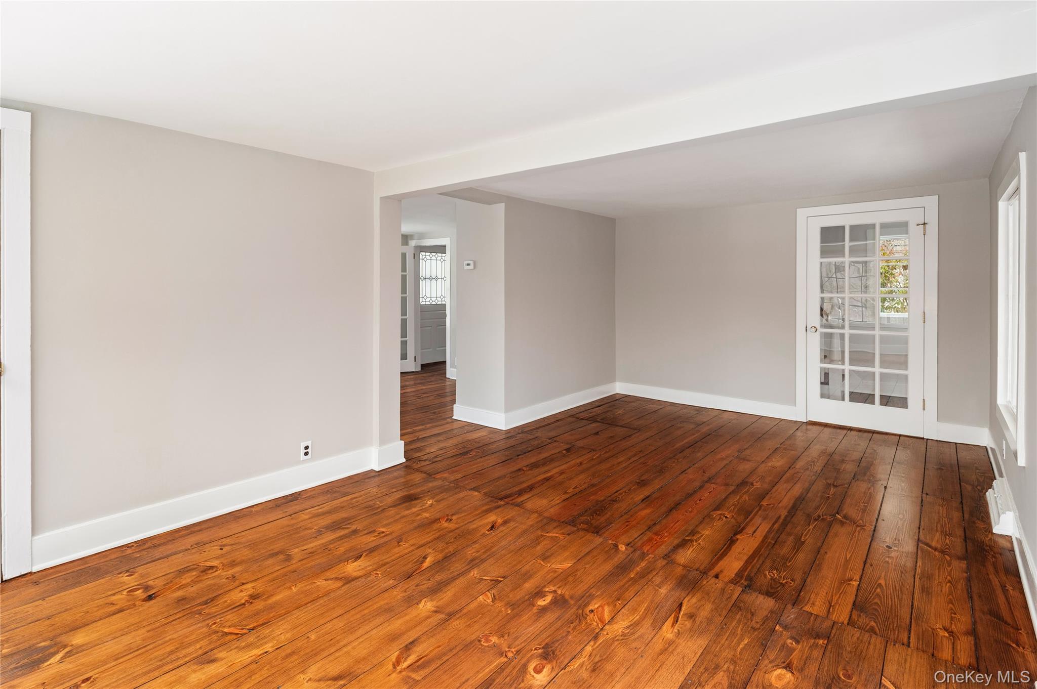 277 Old Post Road Bedford, NY 10506 - Photo 26 of 39 an empty room with wooden floor and windows
