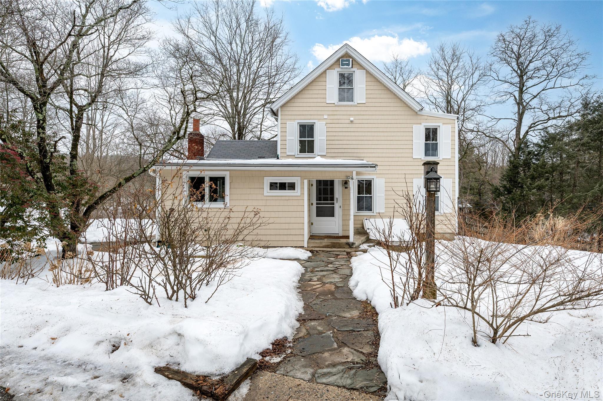 277 Old Post Road Bedford, NY 10506 - Photo 4 of 39 a view of a house with a yard covered in snow