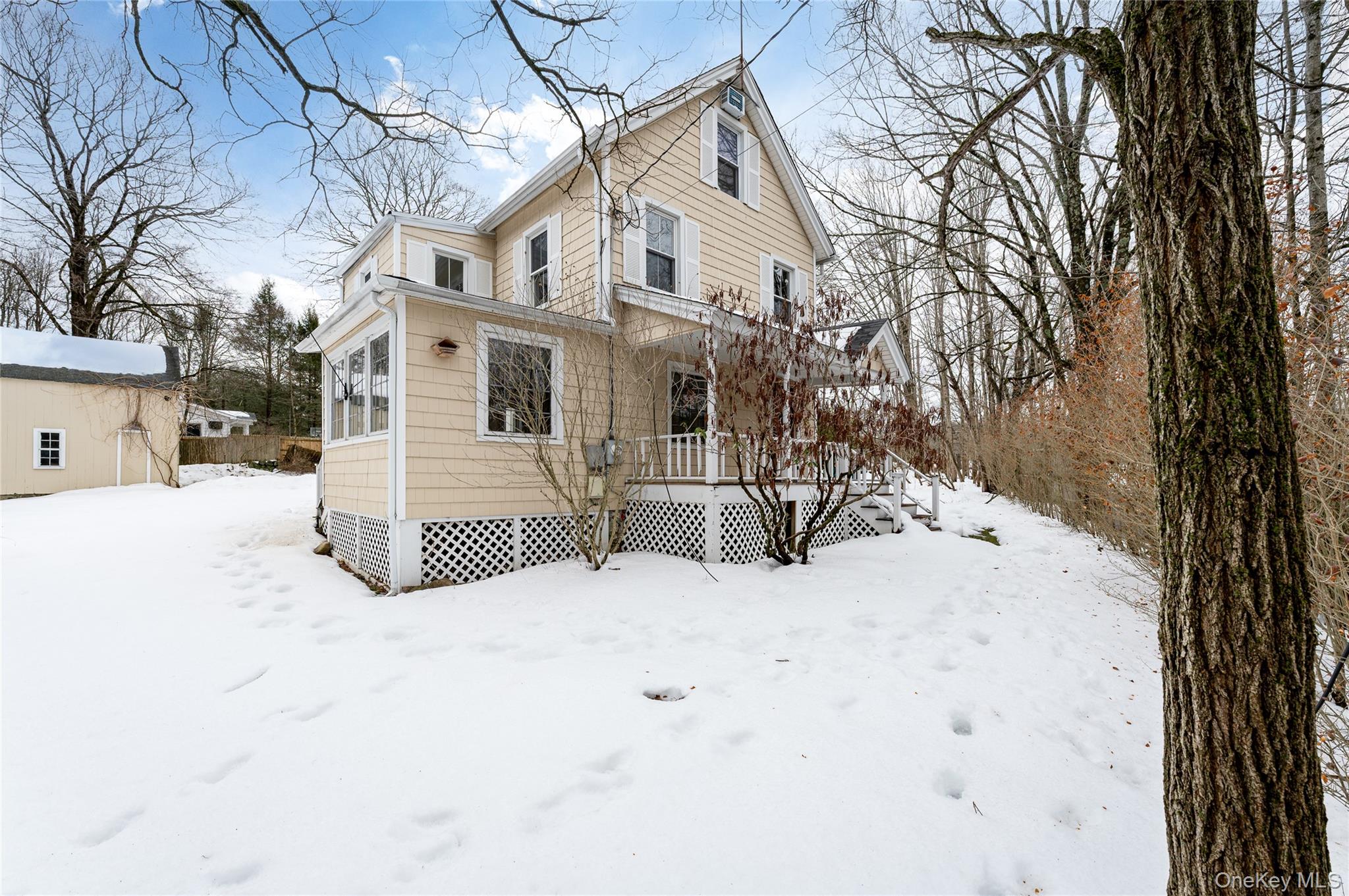 277 Old Post Road Bedford, NY 10506 - Photo 10 of 39 a view of white house with a snow in the background