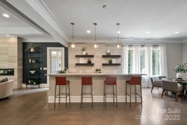 a large kitchen with a table and chairs