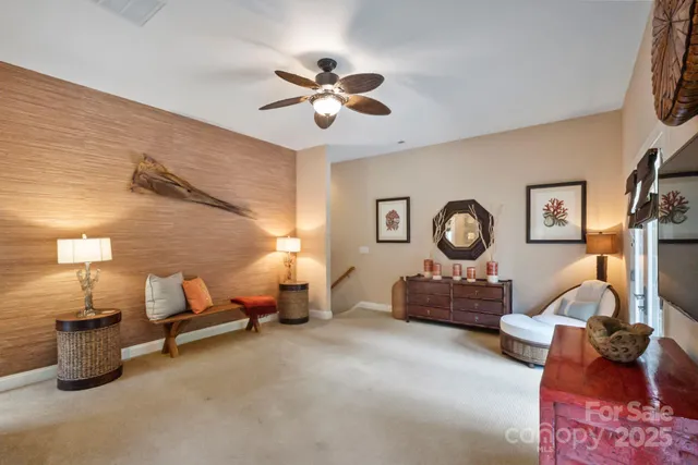 a bedroom with bed and a chandelier