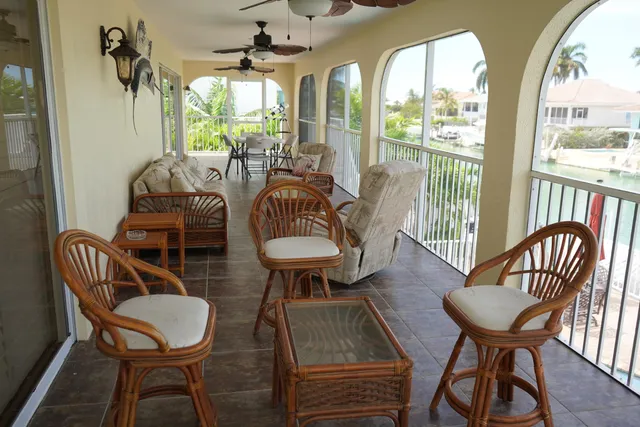 a view of a dining room with furniture wooden floor and chandelier