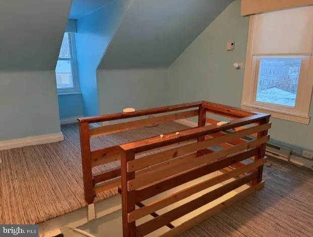 a sitting area with wooden floor