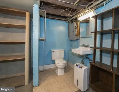 a bathroom with a toilet a sink and a shower