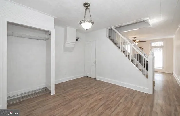 a view of an entryway with wooden floor