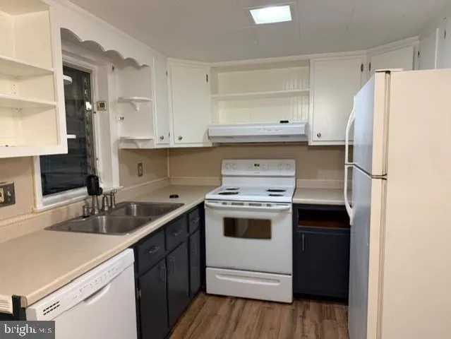 a kitchen with a sink a stove and refrigerator