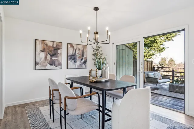 a view of a dining room with furniture window and outside view