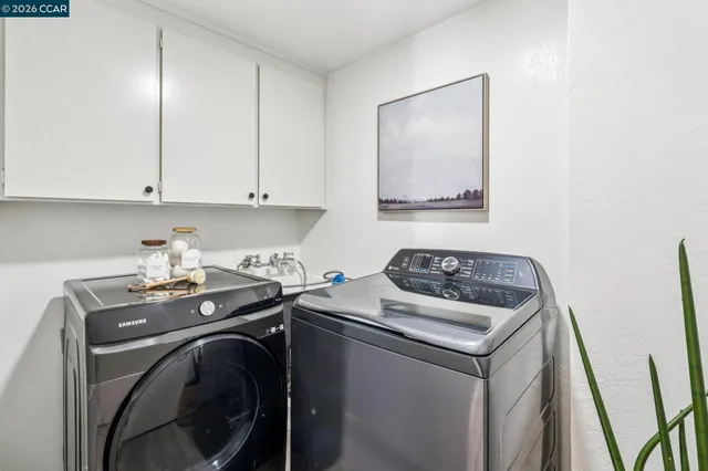 a view of a chairs and table on the wooden deck