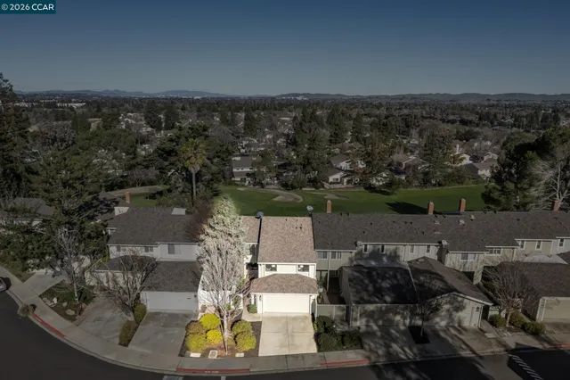 a view of a backyard with a sitting area