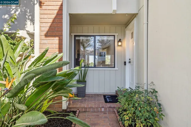 a bathroom with a shower and mirror