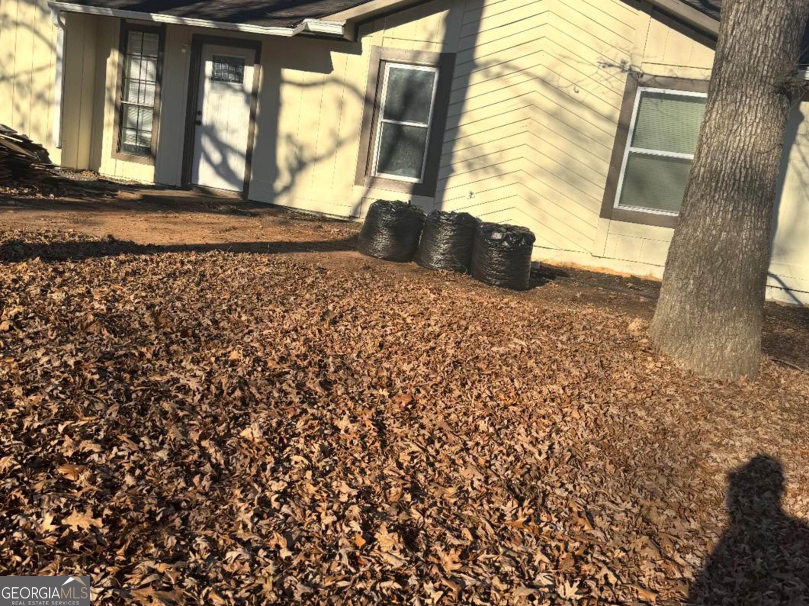 5666 Marbut Road Lithonia, GA 30058 - Photo 3 of 6 a view of an empty room and wooden floor