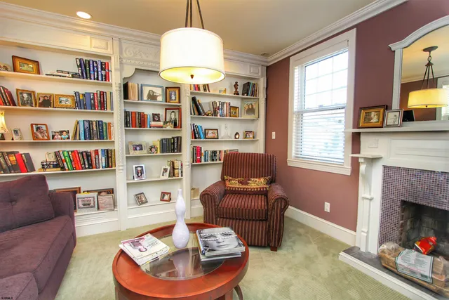 a living room with furniture and a fireplace