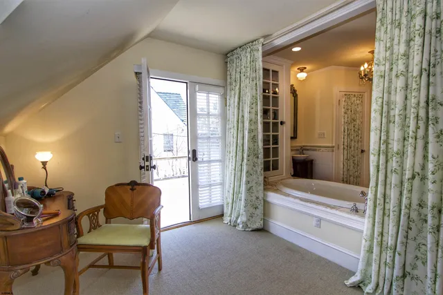 a view of livingroom with furniture and a bathroom