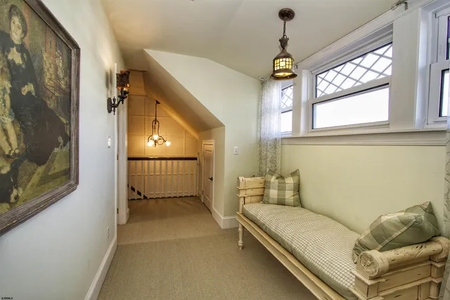 a spacious bedroom with a bed and a window