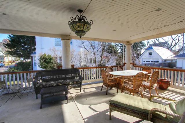a outdoor space with patio furniture and potted plants
