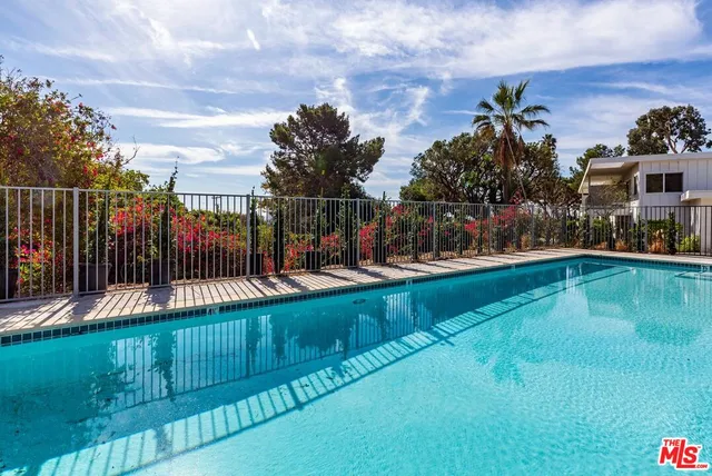 a view of a swimming pool with a garden