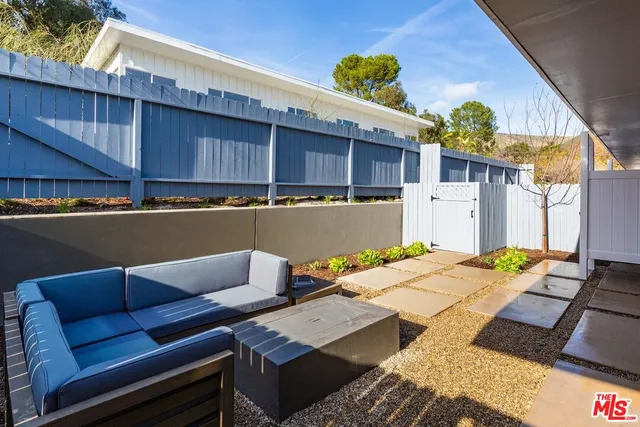 a view of a patio with wooden floor