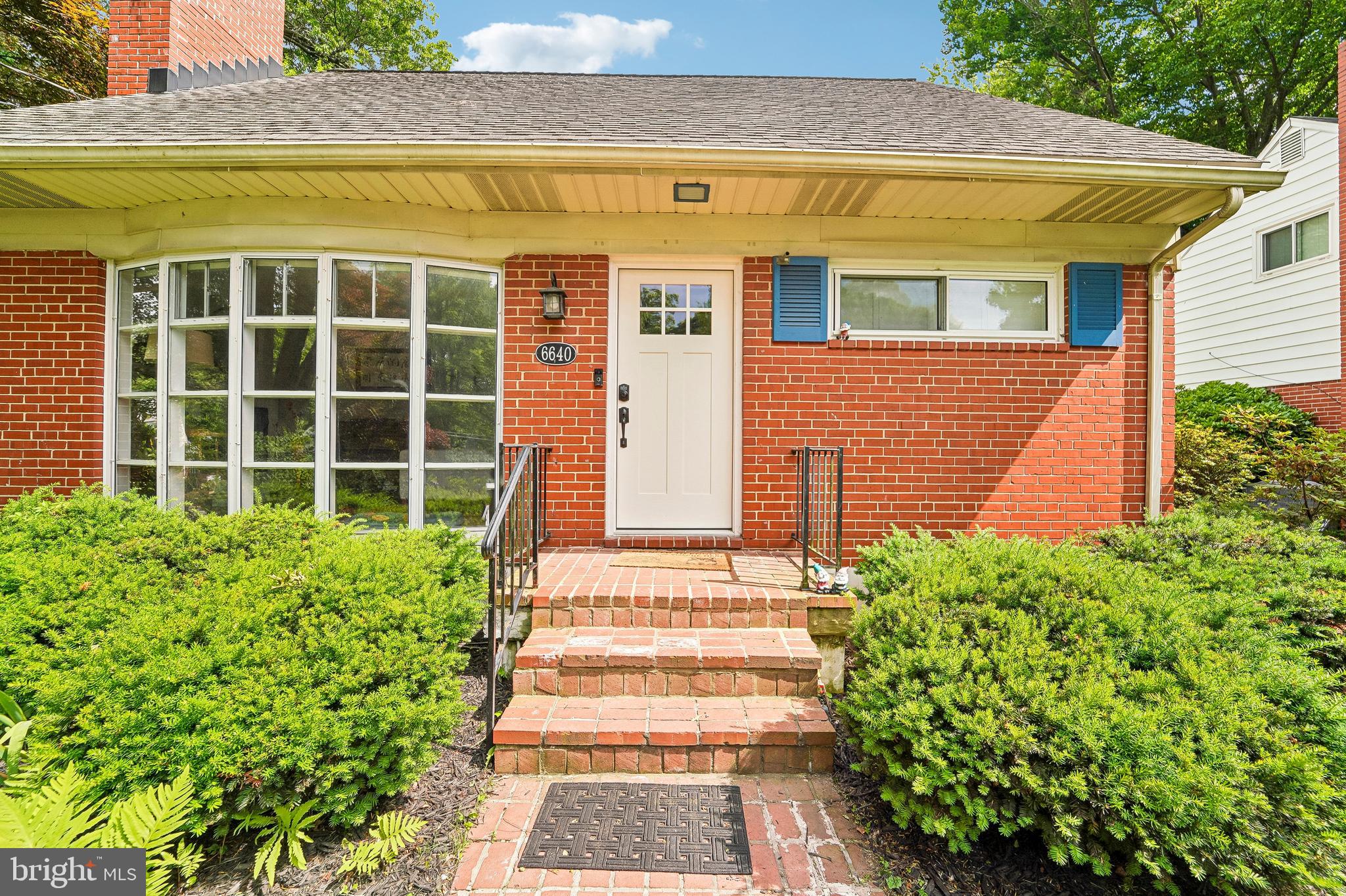 6640 Loch Hill Road Baltimore, MD 21239 - Photo 7 of 35 a front view of a house with a garden