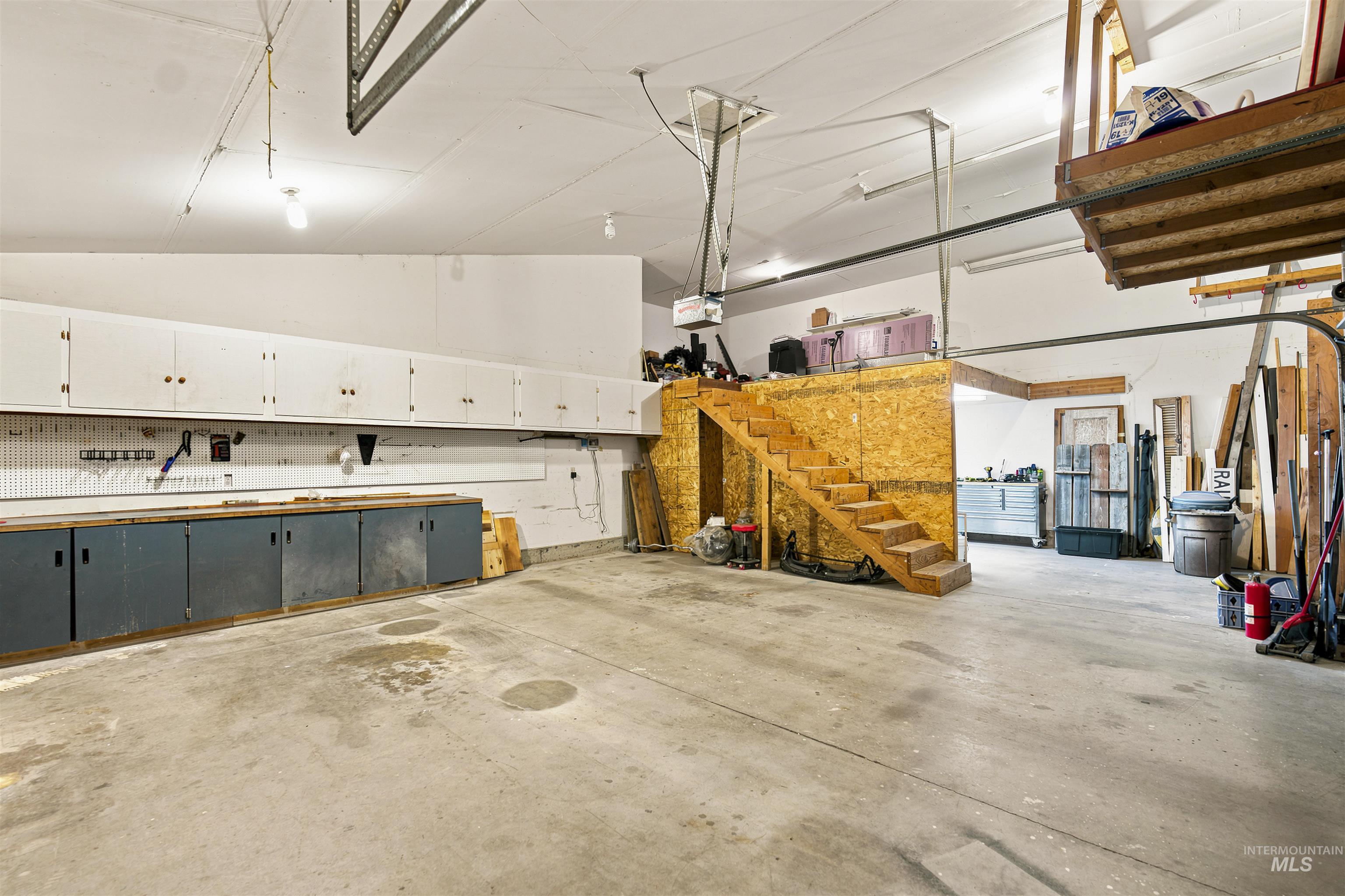 24864 Coventry Drive Caldwell, ID 83607 - Photo 45 of 49 Spacious garage featuring a concrete floor and extensive built-in cabinetry