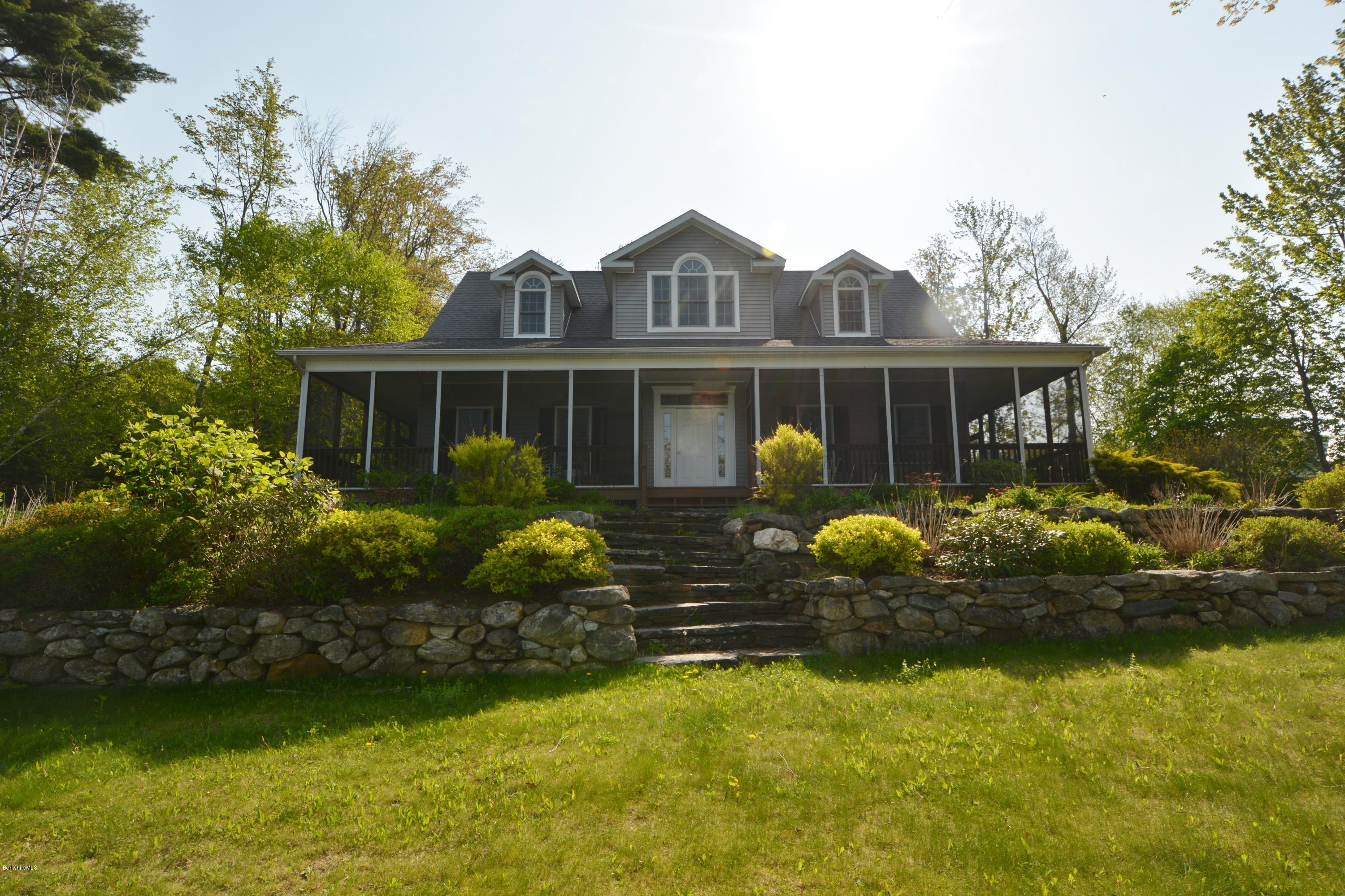 54 Ona Road Tolland, MA 01034 - Photo 2 of 5 a front view of a house with garden