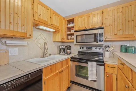 a kitchen with a stove and a microwave