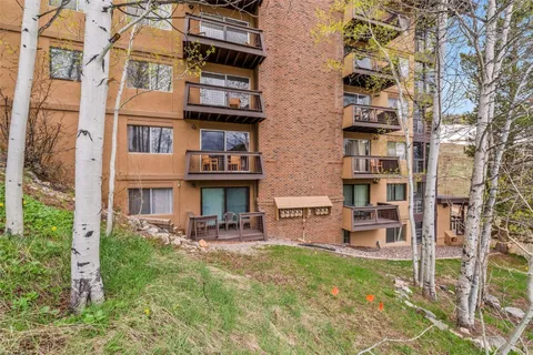 a view of a room that has a bed in it