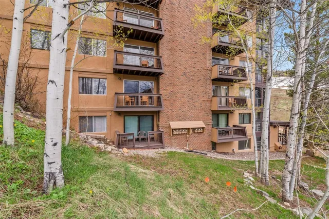 a view of a room that has a bed in it