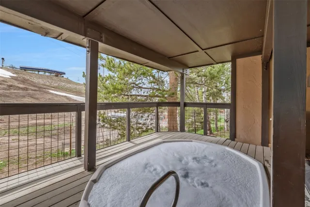 a view of a chairs and table in backyard