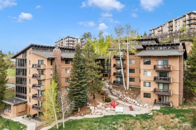 a view of a brick house with a yard