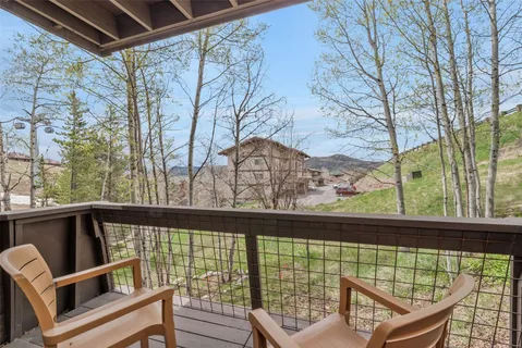 a view of a chair and tables front of the house