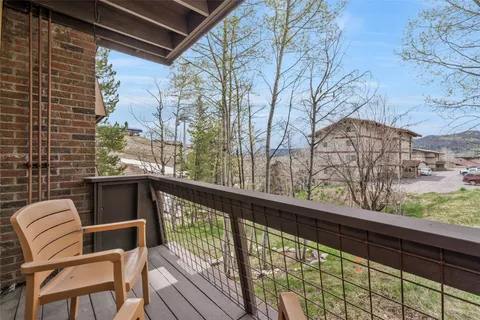 a view of a two chairs in the balcony