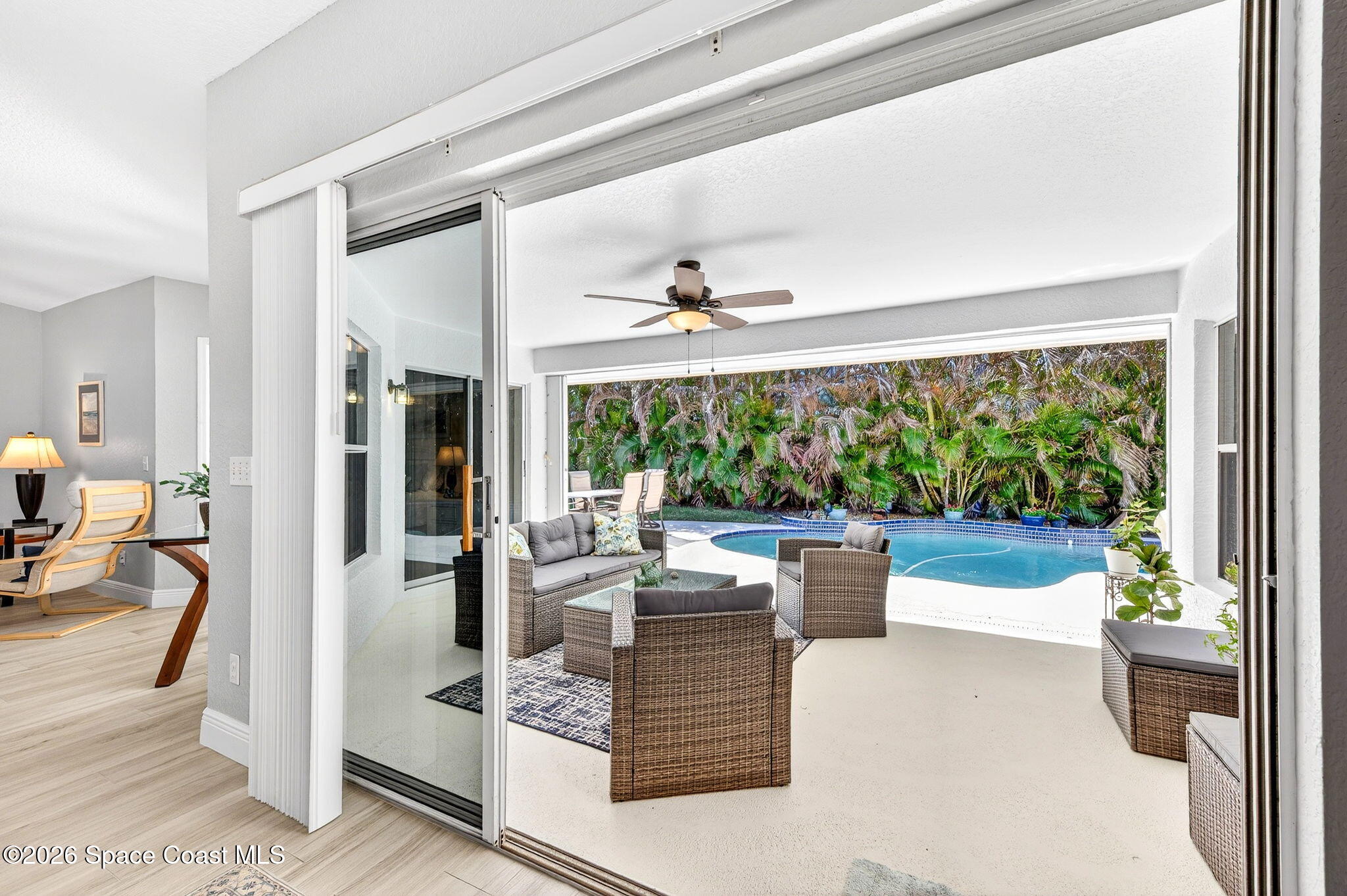 121 Ocean Ridge Drive Melbourne Beach, FL 32951 - Photo 13 of 41 a living room with furniture and a large window