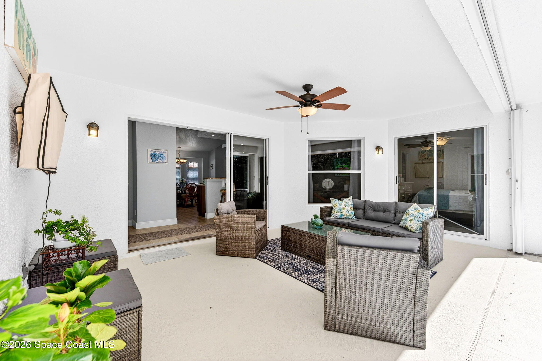 121 Ocean Ridge Drive Melbourne Beach, FL 32951 - Photo 14 of 41 a living room with fireplace furniture and a potted plant