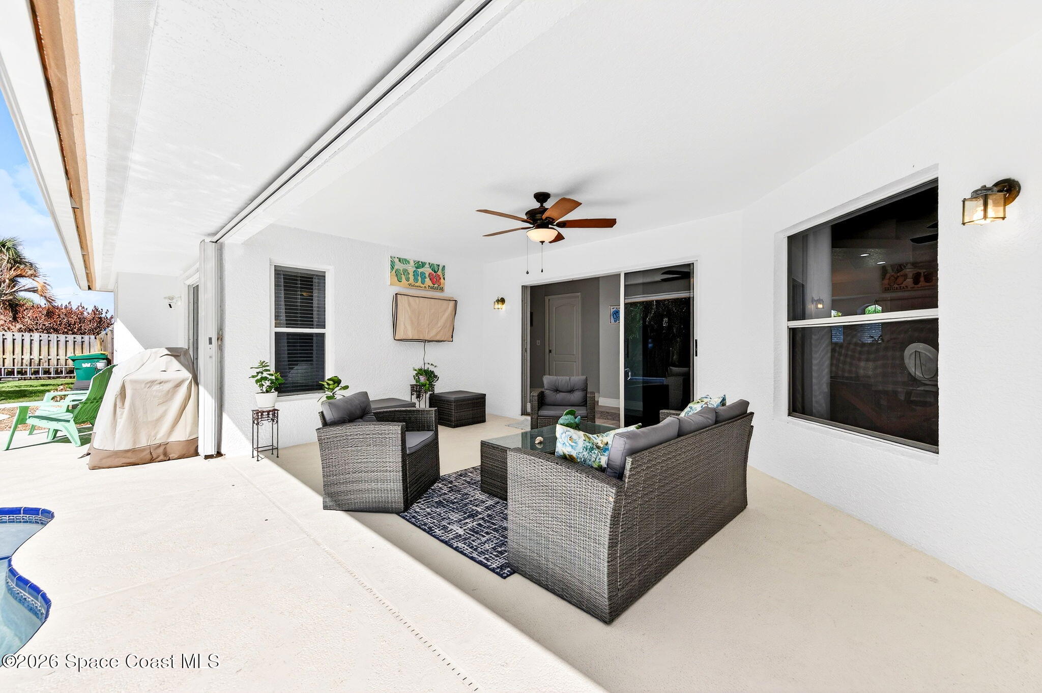 121 Ocean Ridge Drive Melbourne Beach, FL 32951 - Photo 15 of 41 a living room with furniture and a flat screen tv