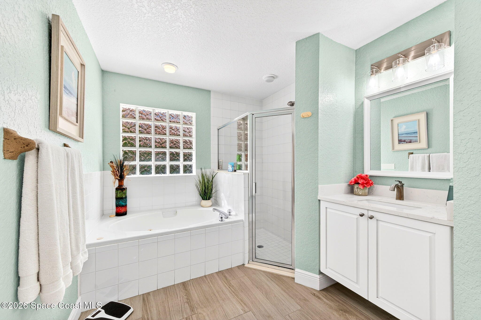 121 Ocean Ridge Drive Melbourne Beach, FL 32951 - Photo 34 of 41 a room with a wooden floor and white cabinet