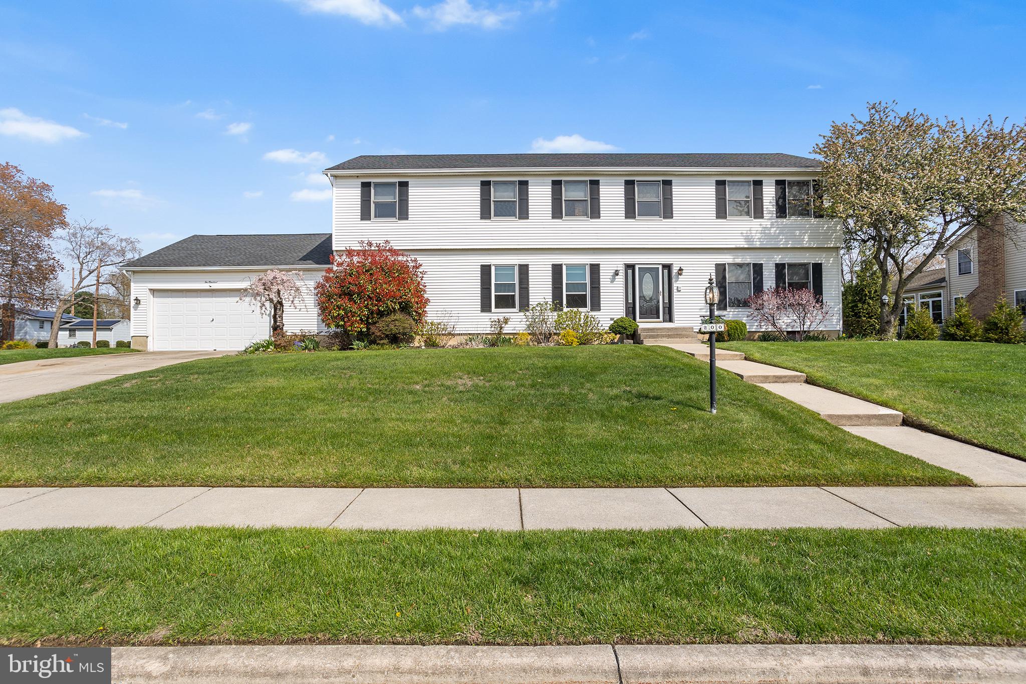 200 Casperson Street Gibbstown, NJ 08027 - Photo 1 of 64 a front view of a house with a yard and lake view