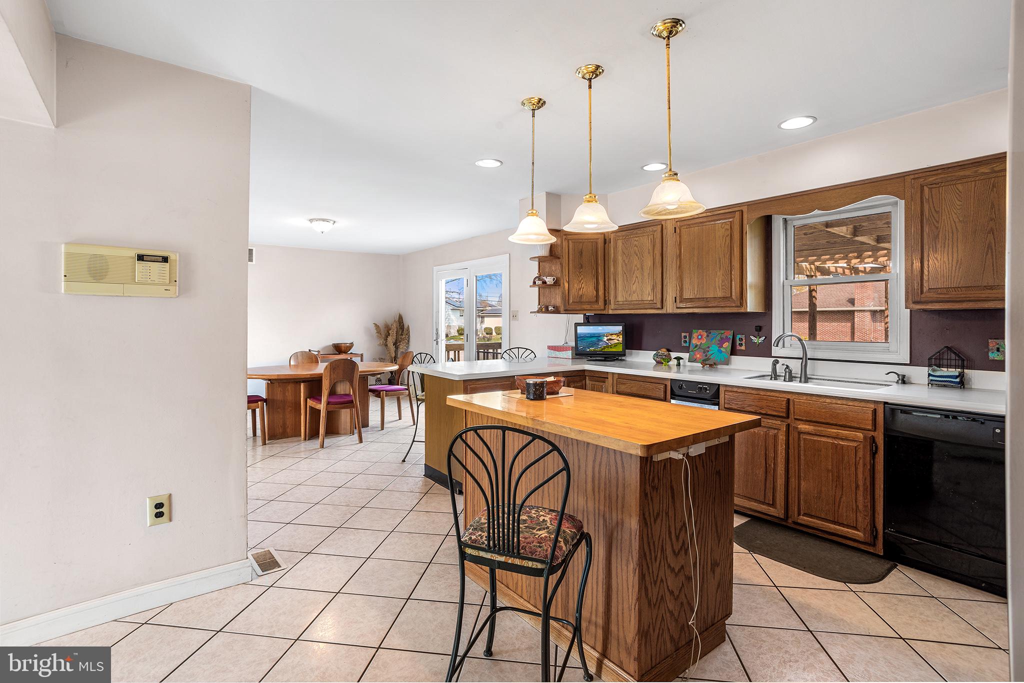 200 Casperson Street Gibbstown, NJ 08027 - Photo 13 of 64 a kitchen with stainless steel appliances granite countertop a sink and a refrigerator