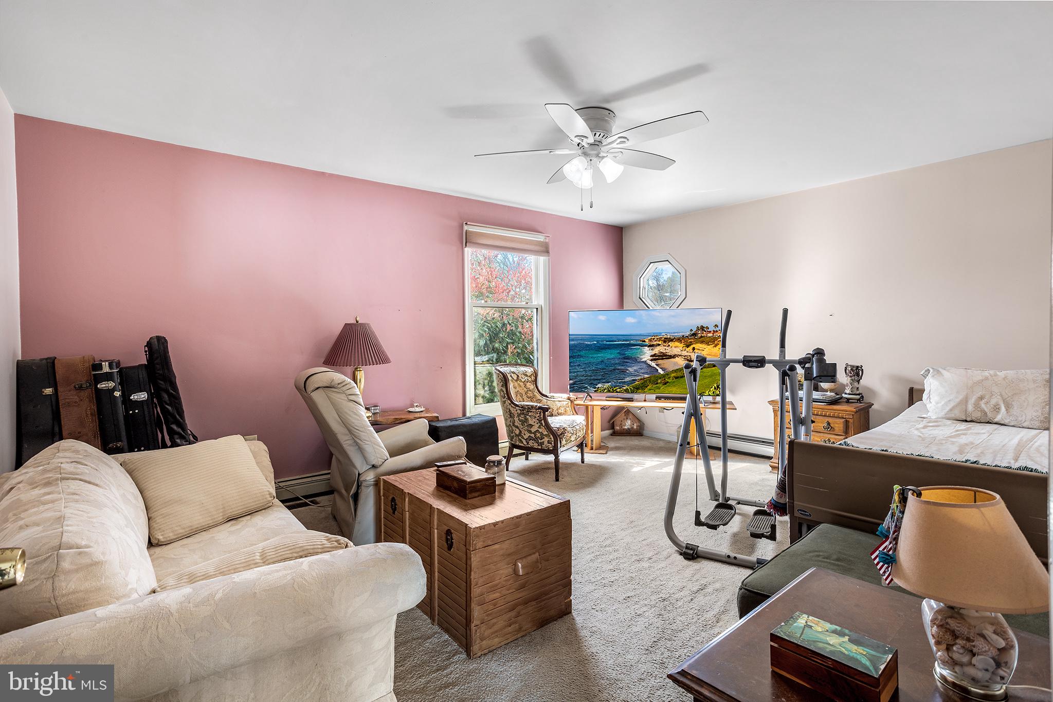 200 Casperson Street Gibbstown, NJ 08027 - Photo 23 of 64 a living room with furniture a fireplace and a flat screen tv