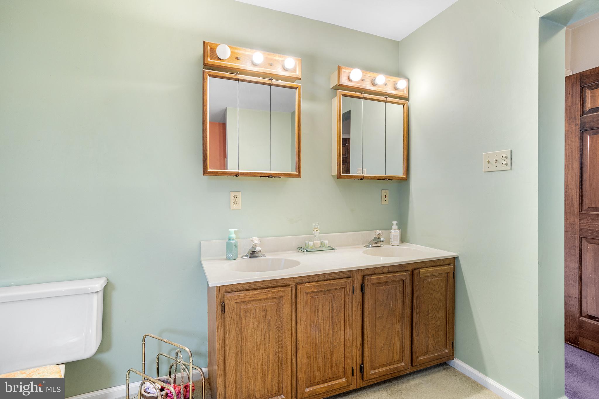 200 Casperson Street Gibbstown, NJ 08027 - Photo 40 of 64 a bathroom with a toilet sink and mirror