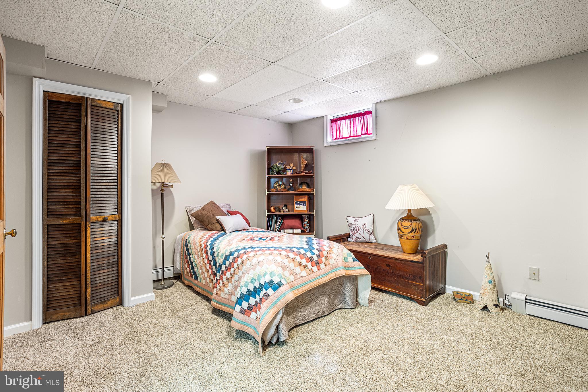200 Casperson Street Gibbstown, NJ 08027 - Photo 49 of 64 a bedroom with bed and a book shelf