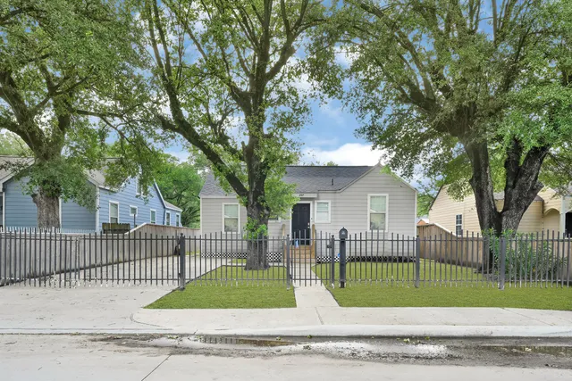 front view of a house with a garden