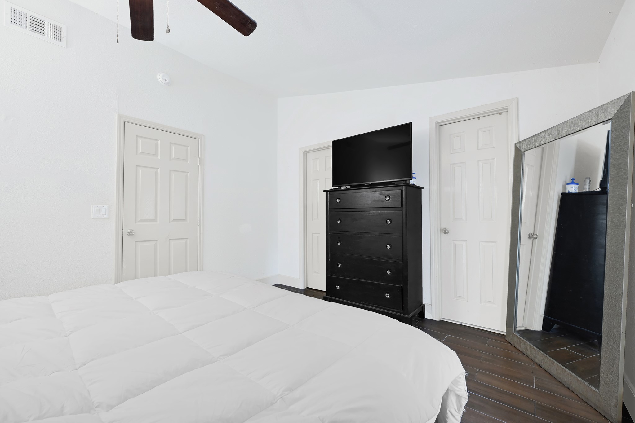 207 Wafer Street Pasadena, TX 77506 - Photo 14 of 26 a bedroom with a bed and a flat screen tv