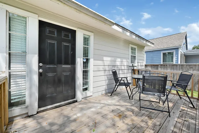 a patio with table and chairs