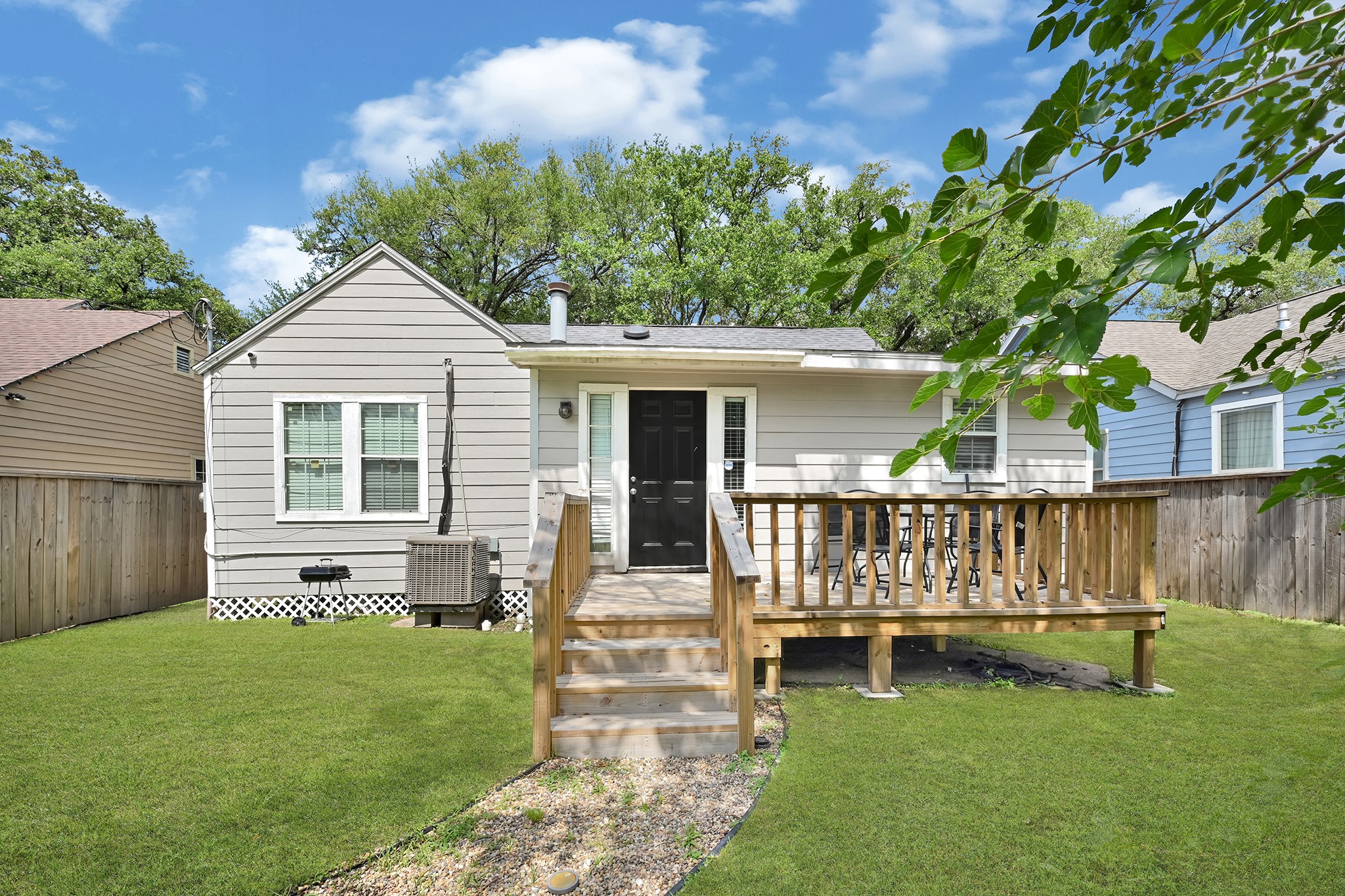 207 Wafer Street Pasadena, TX 77506 - Photo 18 of 26 a view of a house with a yard and deck
