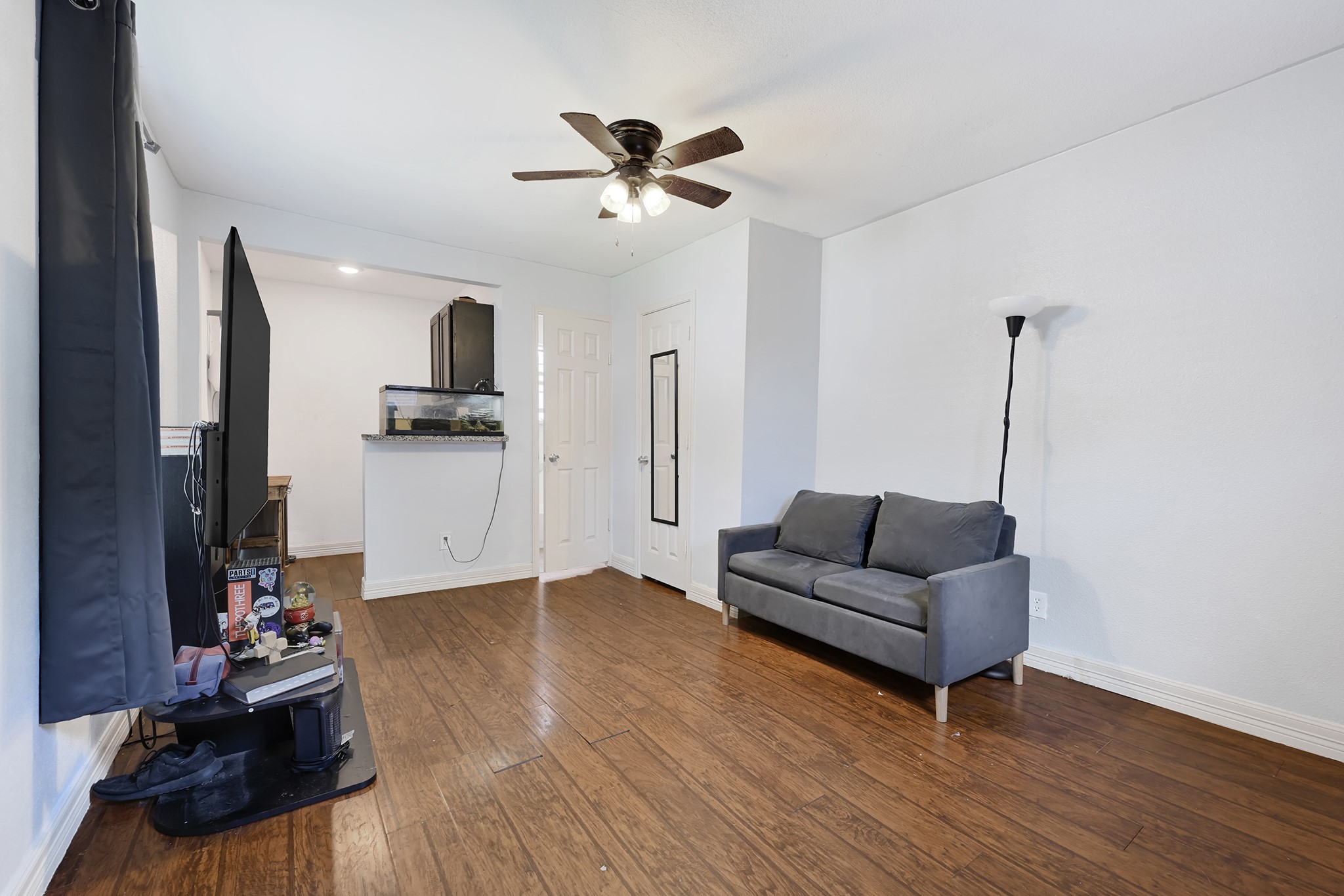 207 Wafer Street Pasadena, TX 77506 - Photo 20 of 26 a living room with furniture and a wooden floor