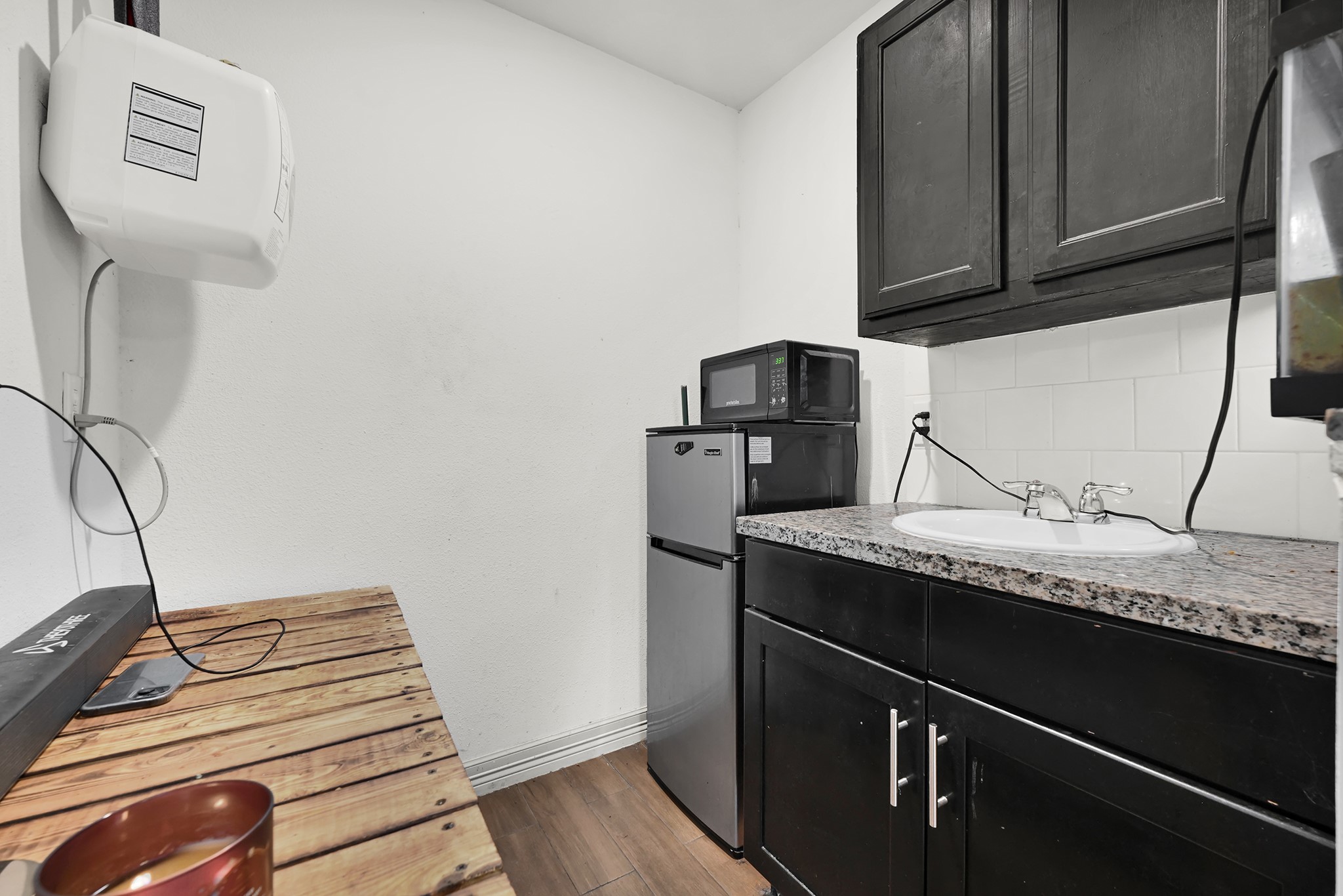 207 Wafer Street Pasadena, TX 77506 - Photo 21 of 26 a view of workspace with wooden floor