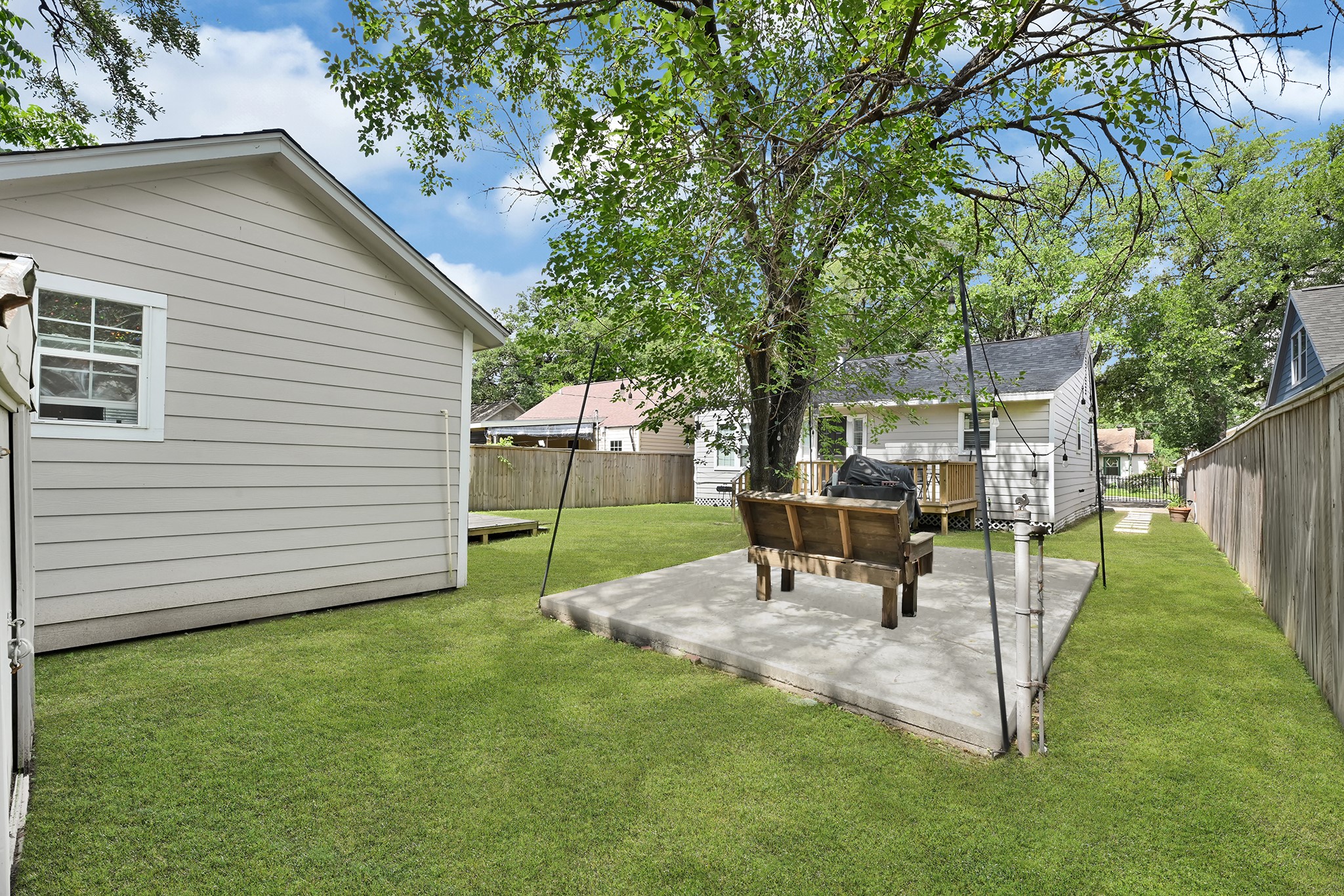 207 Wafer Street Pasadena, TX 77506 - Photo 25 of 26 a view of a garden with a table and chairs