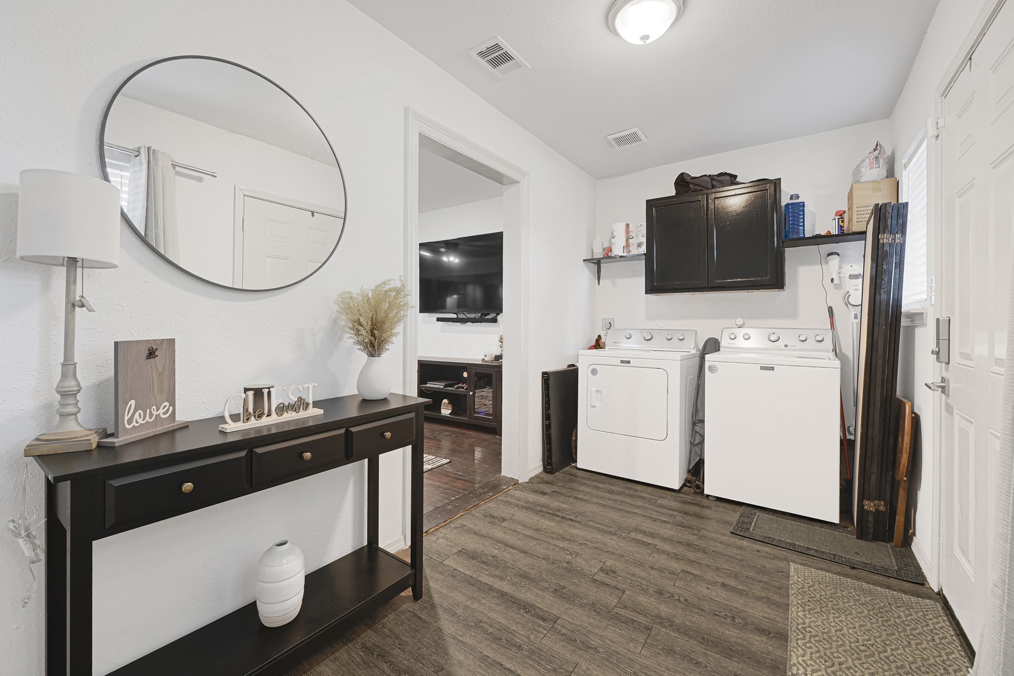 207 Wafer Street Pasadena, TX 77506 - Photo 4 of 26 a view of a workspace with mirror cabinet and a window